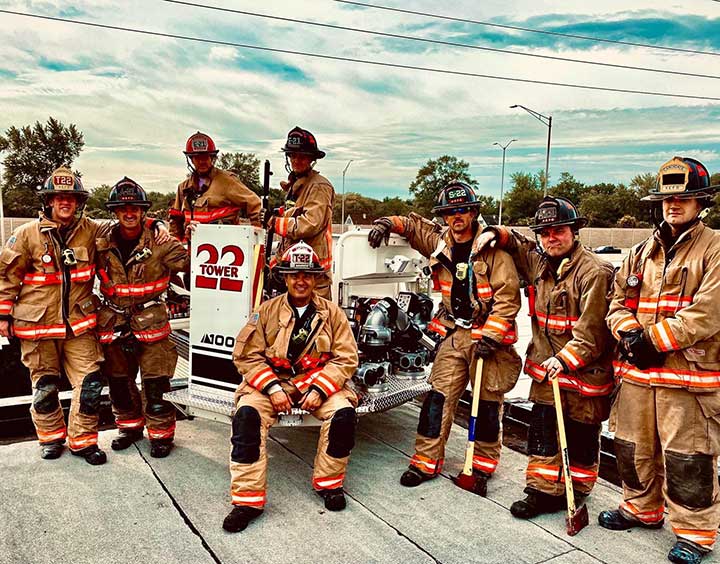 Fire Fighters standing by truck
